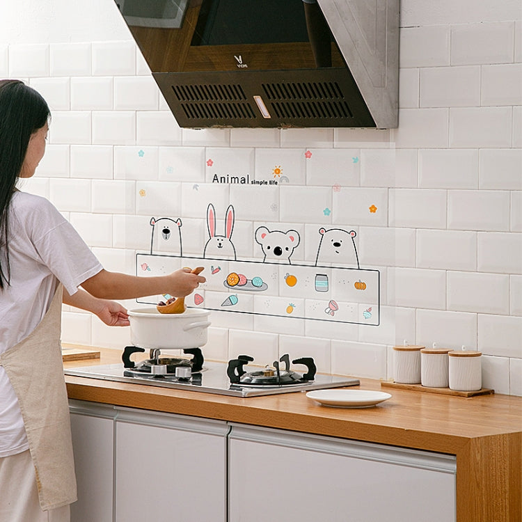 Animal-themed transparent oil-proof backsplash sticker set applied over the stove area