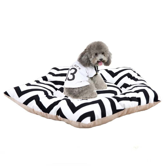 Pet sleeping mat bed with black-and-white zigzag cover, with small dog resting