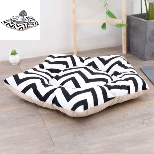 Small pet sleeping mat bed with black-and-white zigzag cover and light beige base