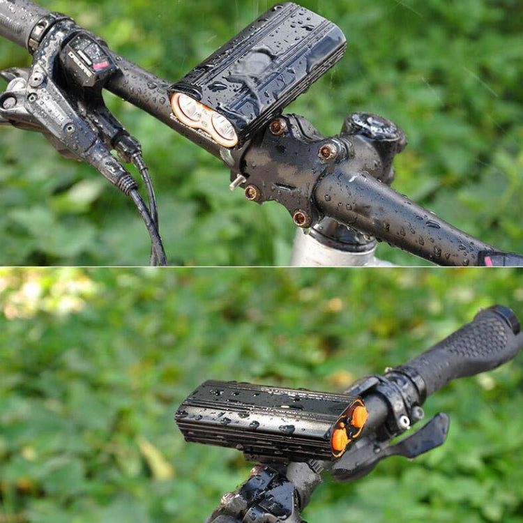 Waterproof front bike light with raindrops on housing mounted to handlebars