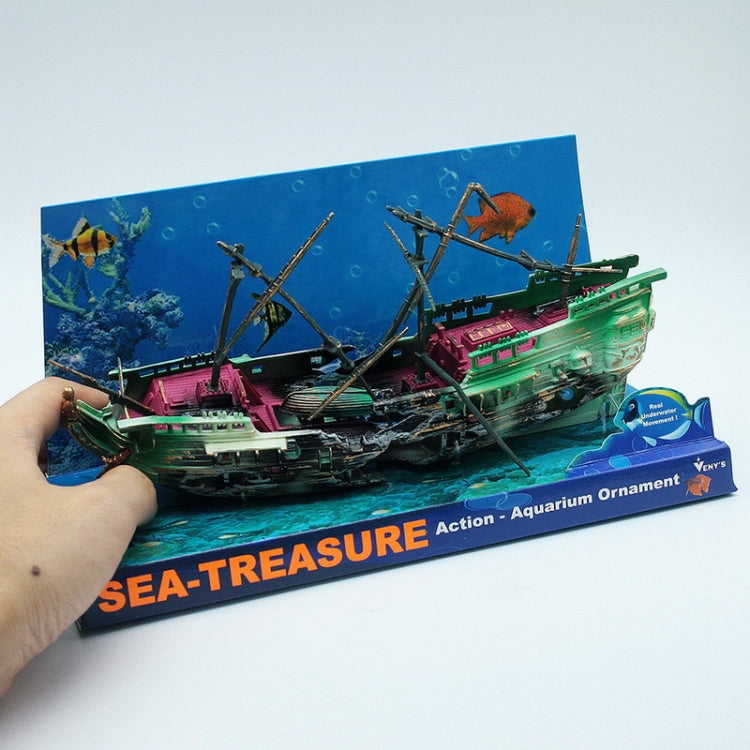 Toy shipwreck aquarium ornament held up on SEA-TREASURE card with colorful deck