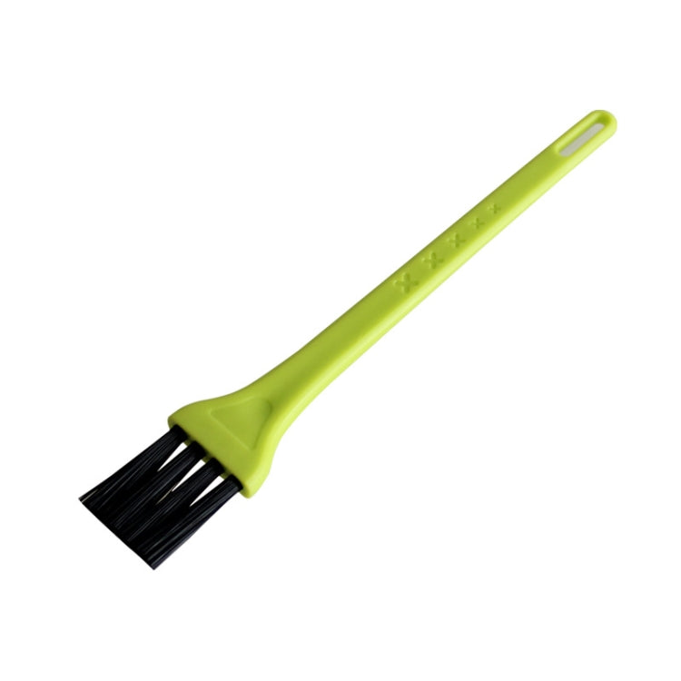 Green handled small vacuum cleaning brush with dark bristles