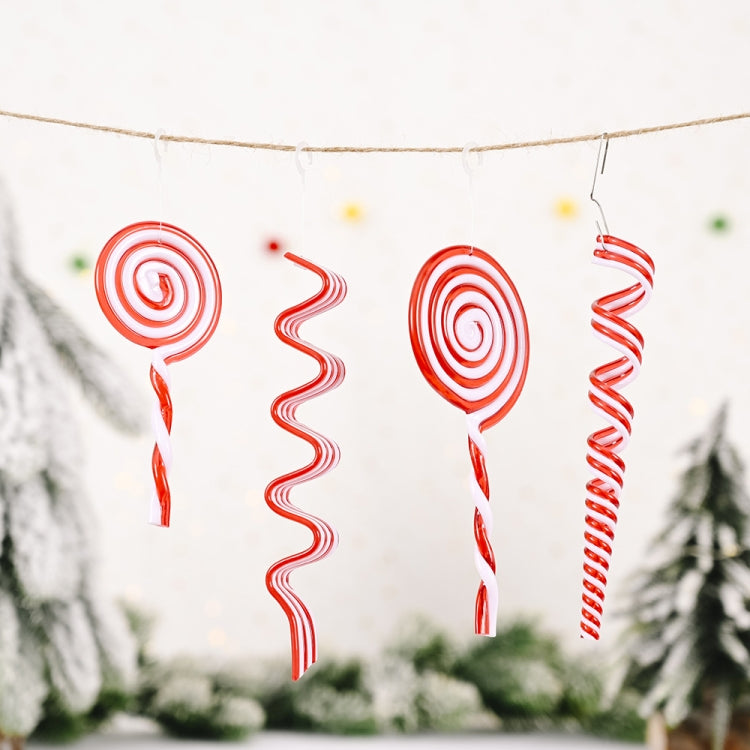 Red and white candy spiral Christmas ornaments strung on a twine banner