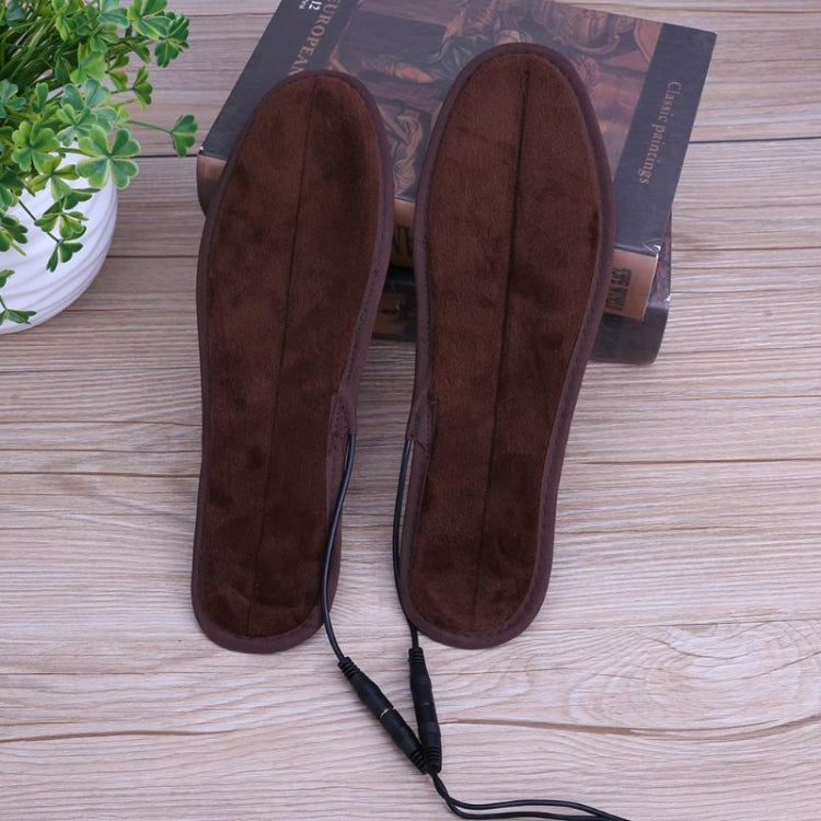 Pair of dark brown heated USB shoe dryer insoles with USB-ready power cords