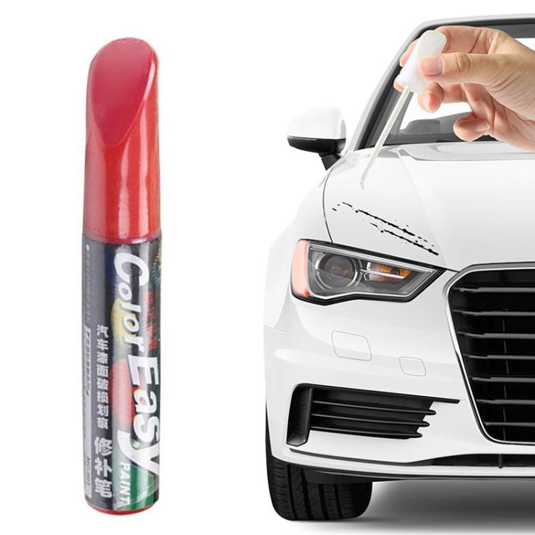 Car scratch repair paint pen, red barrel; hand applies paint to a hood scratch on a car.