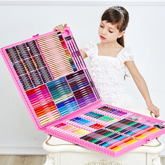 Kids art set in pink case, open with colored pencils and drawing tools