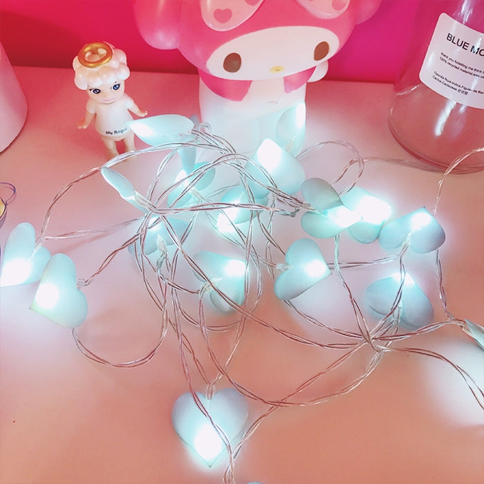 Blue heart-shaped LED lantern string lights, wire strands with glowing hearts