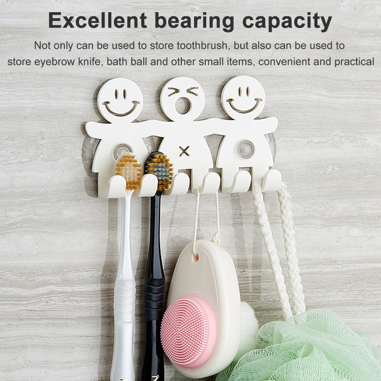 Smiley suction-cup holder set mounted with toothbrushes and one storage brush