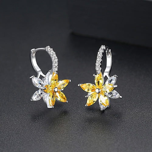 Yellow flower stud earrings with clear cubic zirconia petals and hoop-like hinge backs