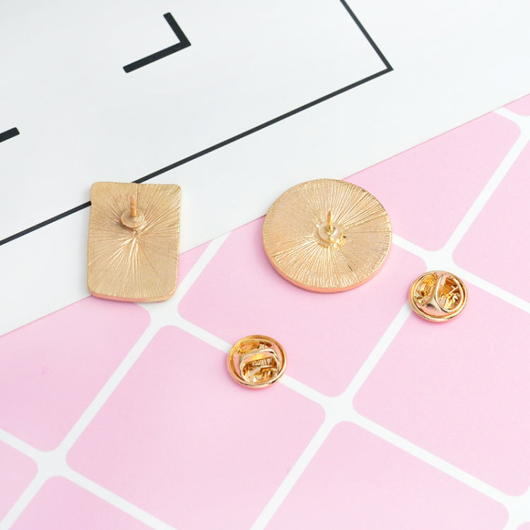 Gold-tone brooch pins with sunburst circle and square shapes, and pin backs.