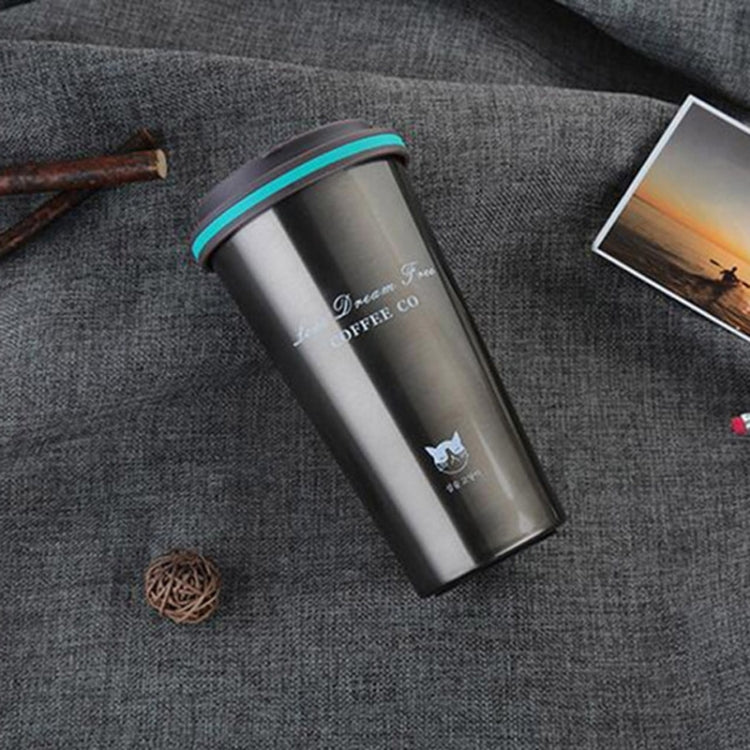 Portable stainless steel vacuum coffee mug with teal rim and lid, printed graphics