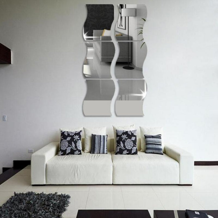 Wavy wall mirror sticker with multiple clear reflective panels reflecting room decor