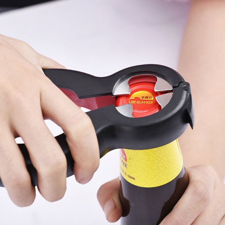 Jar bottle opener claw with red ring, gripping a can lid with LEE KUM KEE label