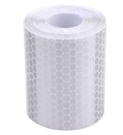 White reflective safety tape roll with honeycomb hex pattern, wide adhesive warning film