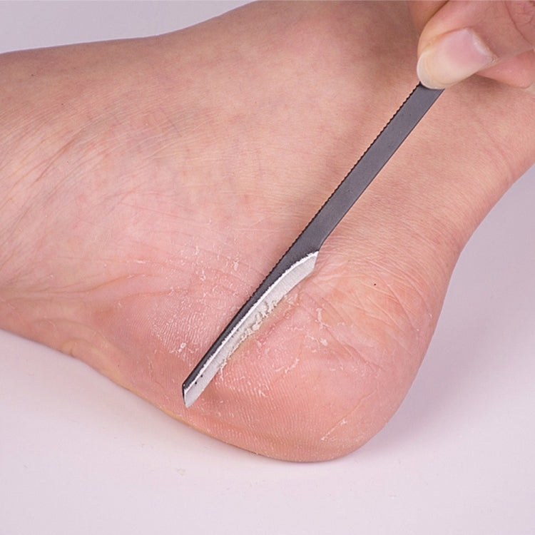 Foot callus scraper tool with metal blade edge on dark handle