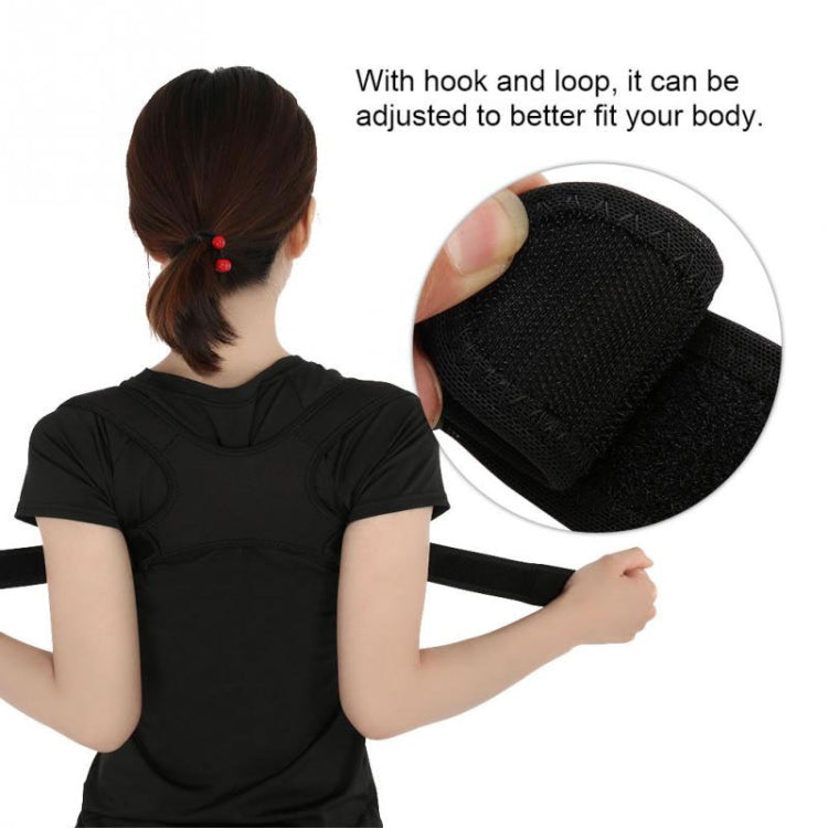 Black posture corrector belt worn by woman, textured shoulder pad close-up