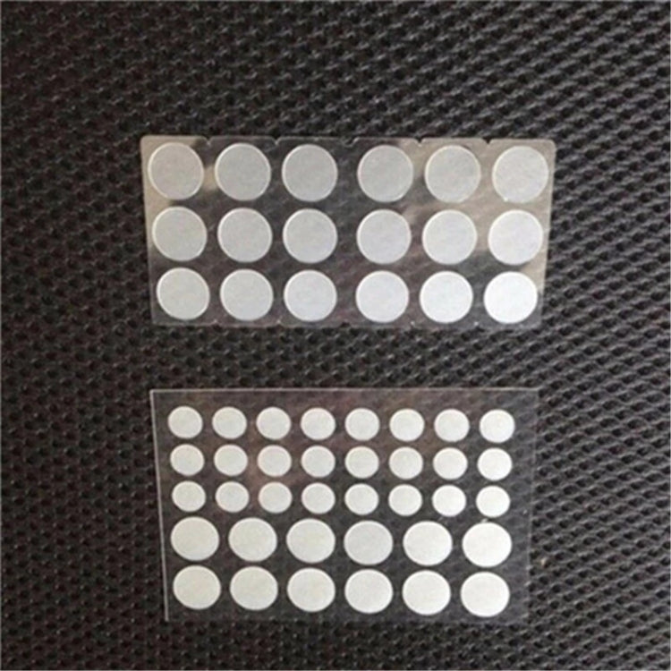 Set of round white acne patches on backing sheet, two rows