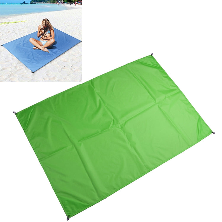 Green waterproof picnic camping mat with corner grommets, folded panel design