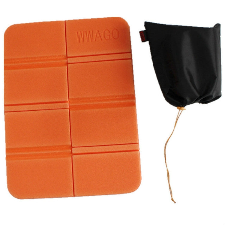 Orange folding camping mat with black storage pouch and drawstring cord