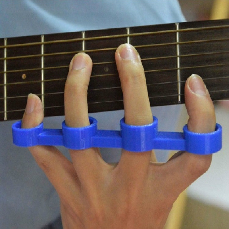 Blue finger spacer device worn on hand near guitar strings