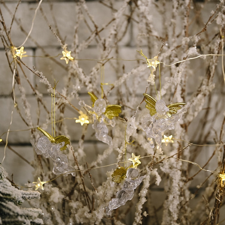 Transparent angel ornaments with gold wings on delicate gold wire string lights