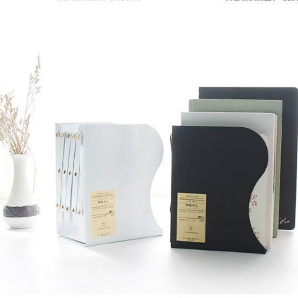 Black and white metal bookend stand with label