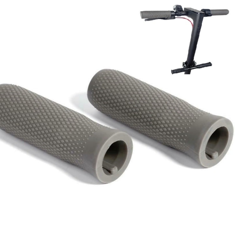 Pair of textured light gray silicone scooter handlebar grips with open ends, angled view