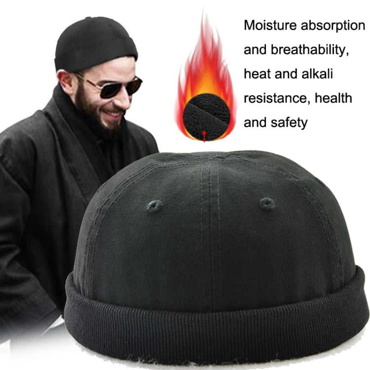 Black foldable brim hat worn by a man with sunglasses