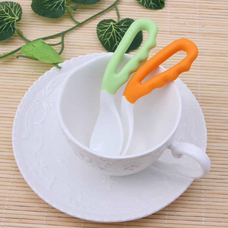 Baby curved feeding spoons set in white bowl: green and orange handles, curved white tips