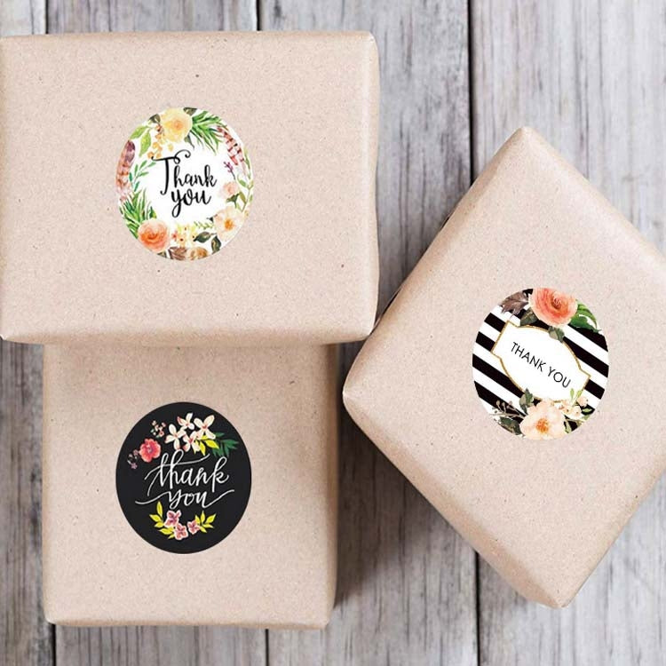 Thank you seal stickers with floral and striped round designs on kraft gift boxes