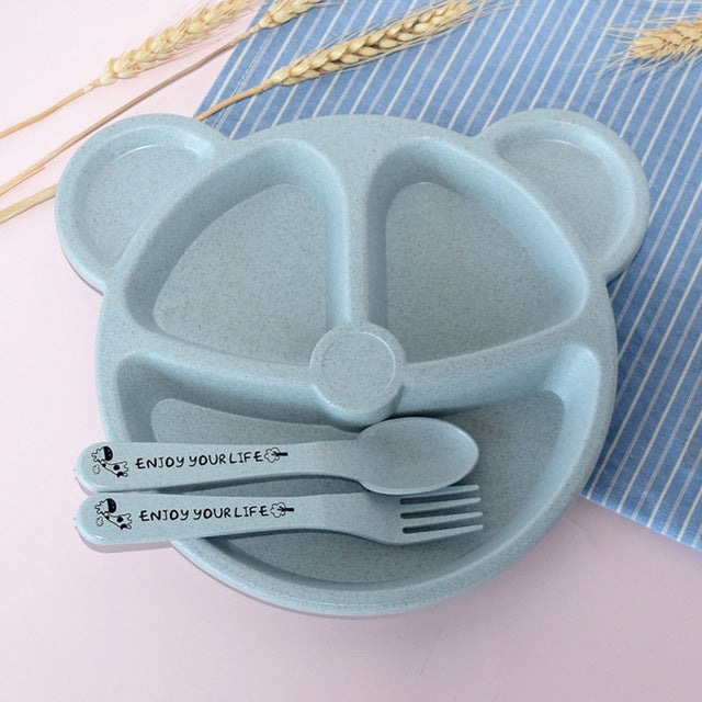Light blue bear-shaped plate with spoon and fork, front view with utensil labels
