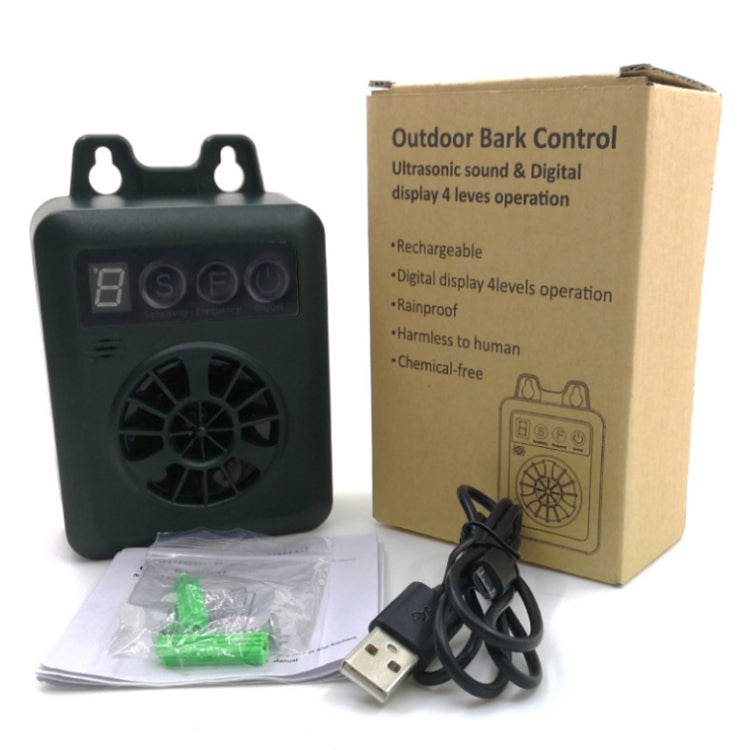 Green ultrasonic bark repeller kit with device, USB cable, and instruction papers