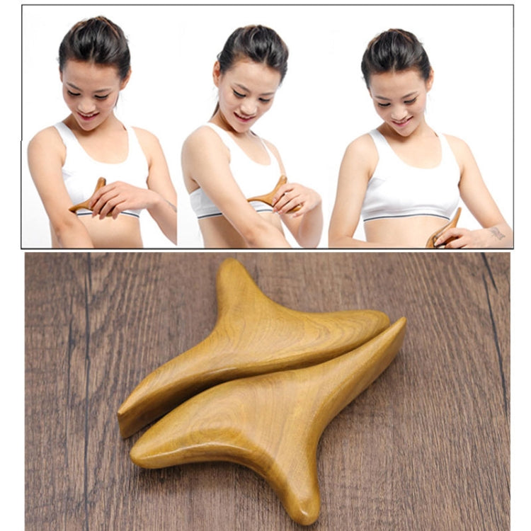 Star-shaped wooden massage tool on a wooden tabletop