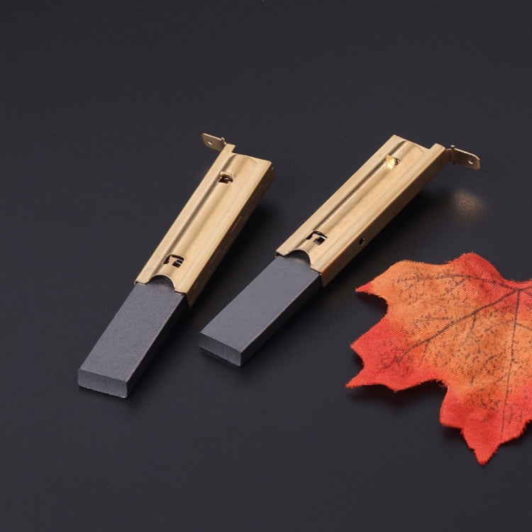 Carbon brush inserts pair with copper plates and dark graphite blocks