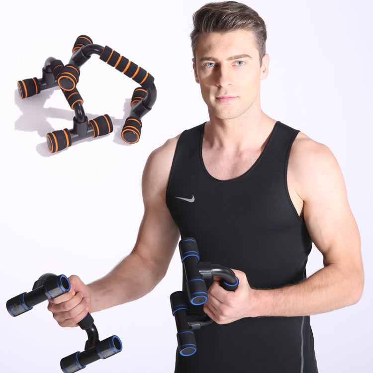 H-shaped push-up bracket with black frame and orange ringed grip pads in use
