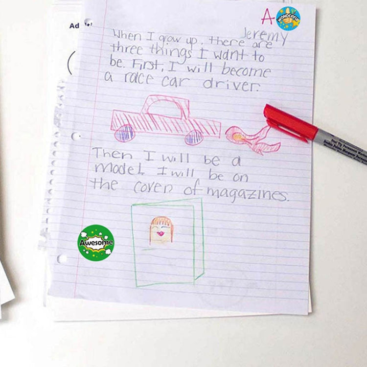 Round reward stickers placed on a notebook page for classroom praise