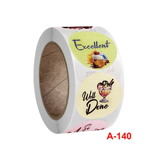 Close-up of round reward sticker roll showing Excellent and Well Done designs