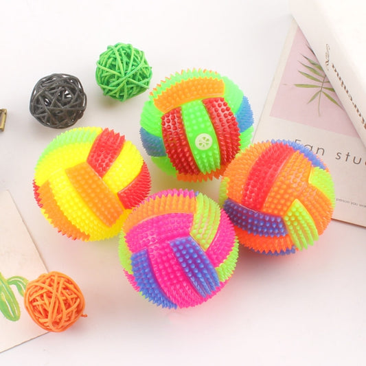 Colorful luminous spiky massage balls with bumpy texture, plus a green string ball