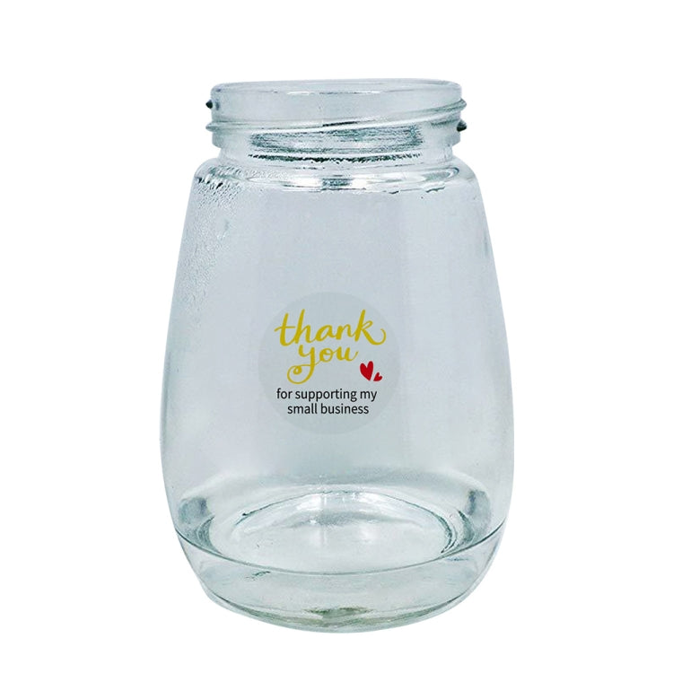Transparent thank-you sealing sticker on glass jar, gold script with small red heart