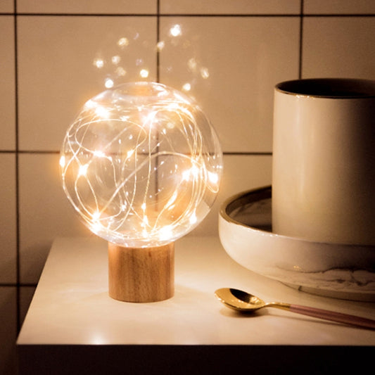 Round wood base LED star-moon night light with glowing glass globe