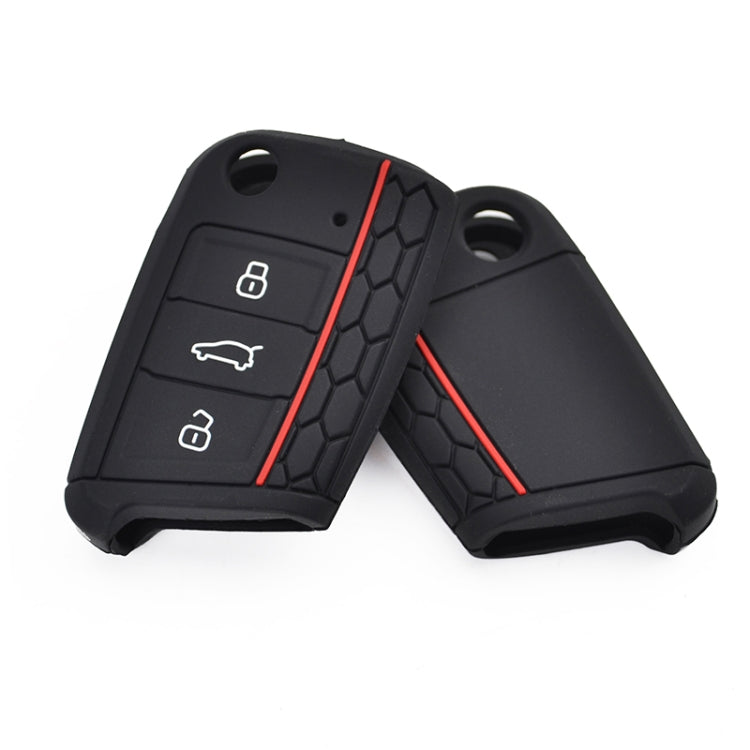 Pair of black silicone key fob covers with red trim and keyring holes