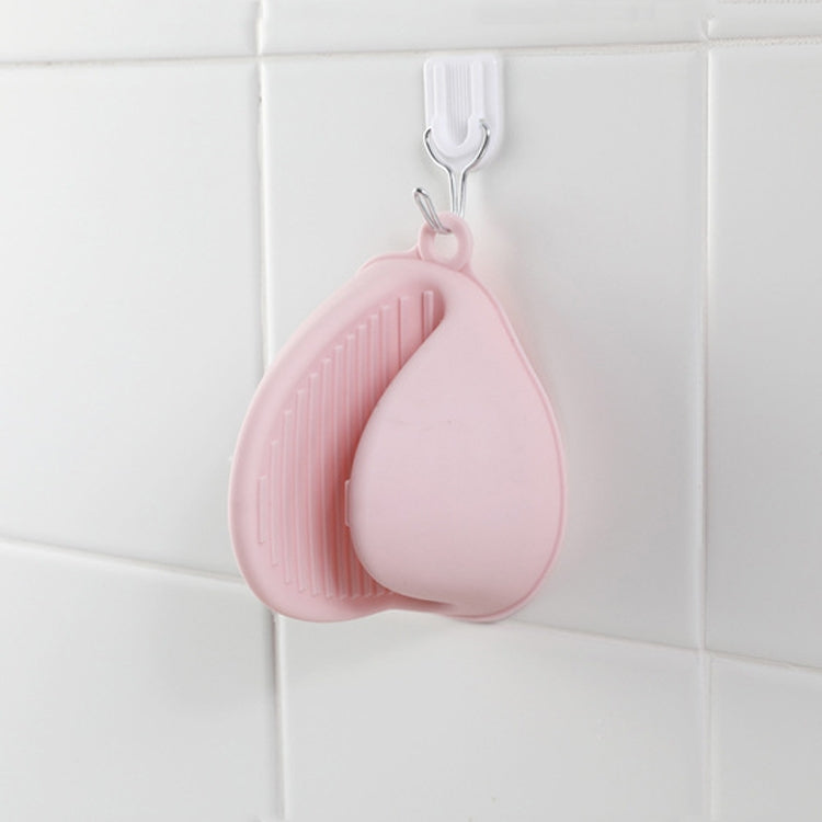 Pink silicone heat mitt with hanging loop and ribbed grip surface