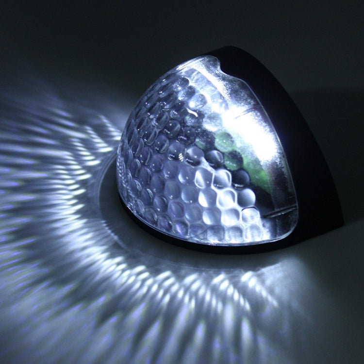 Illuminated semicircular solar LED wall light with clear lens and white glow