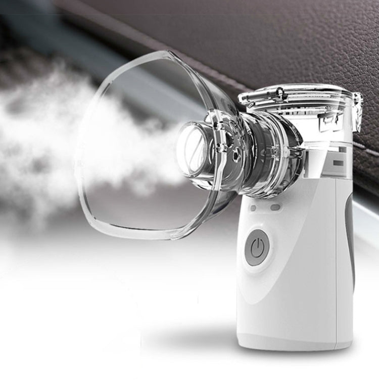 Ultrasonic micro-mesh atomizer releasing fine mist through clear mask