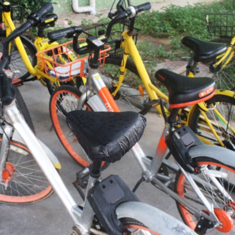Bicycle saddle with black waterproof cover on bike rack, rain-ready PVC protection