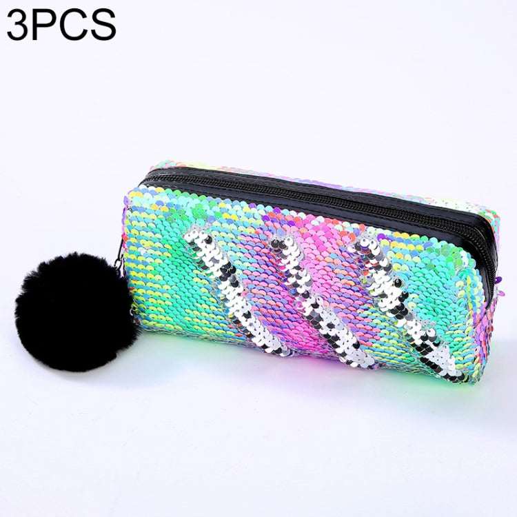 Reversible sequin pencil case with rainbow striped sequin pattern, zipper, and pom-pom.