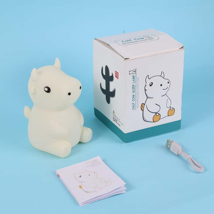 White silicone calf cow night light with retail box, cable, and instruction card.