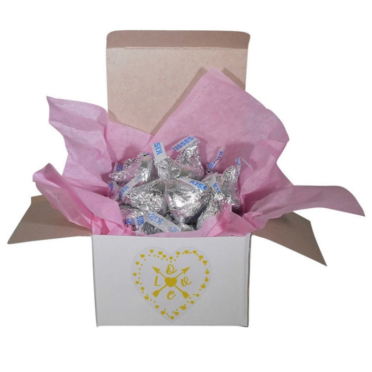 Heart-shaped thank-you sticker on gift box, transparent with gold Valentine’s heart
