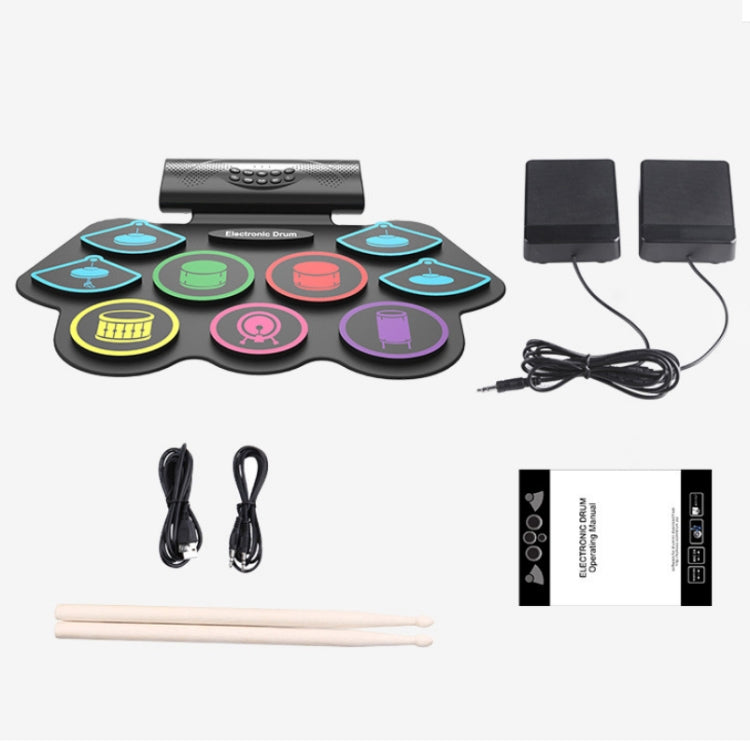Electronic drum starter set with colored pads, drumsticks, cables, and two speakers