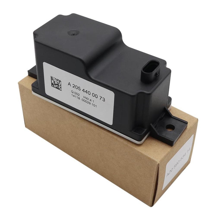 Black controller module with label and mounting tabs shown on its retail box